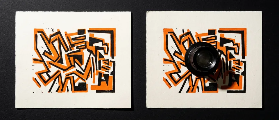 Two near-identical prints side by side with a loupe, for AI-content claims