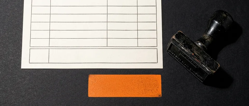 A blank takedown form with a stamp on a black background