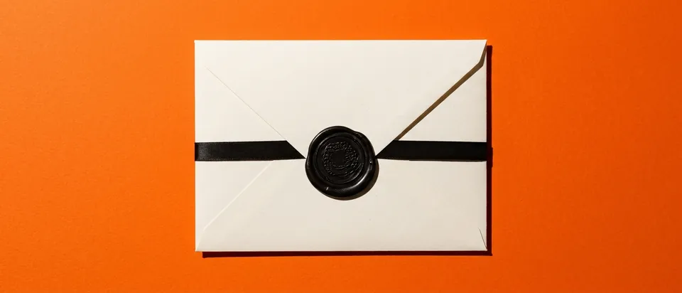A sealed envelope with a wax seal on an orange background